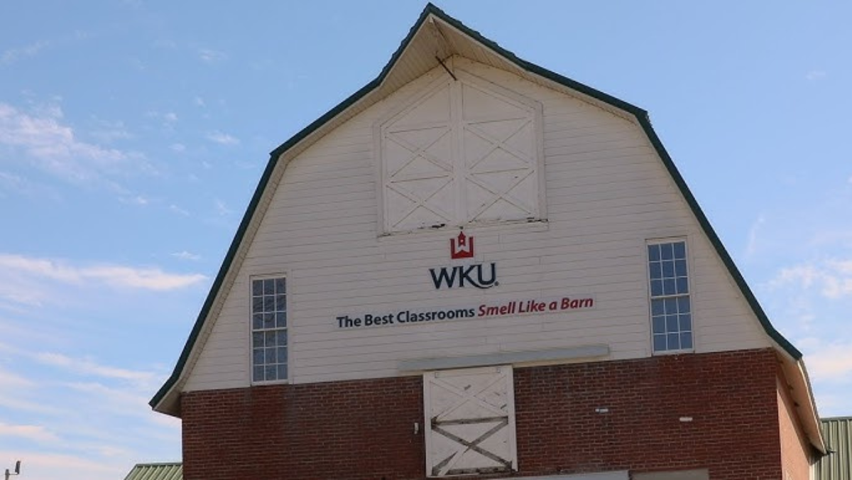 WKU barn-style agricultural building with slogan promoting hands-on dairy technology learning.